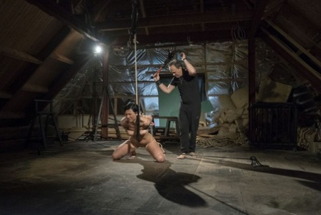 Dark haired slave Adelle Sabelle is tortured before being used for sex