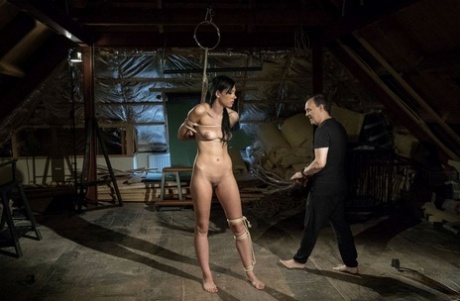 Dark haired slave Adelle Sabelle is tortured before being used for sex