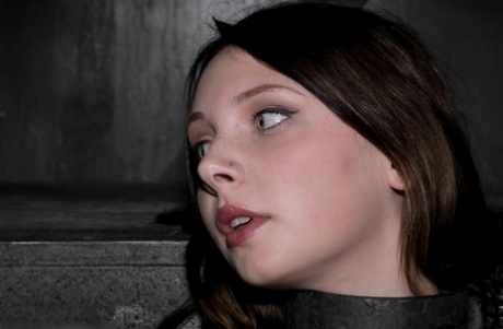 Barely legal Brazilian sub Sara Scott posing bound in the dungeon