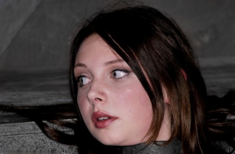 Barely legal Brazilian sub Sara Scott posing bound in the dungeon