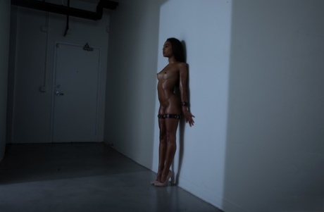 Sweet skinny ebony Scarlit Scandal takes a boner while chained and in heels